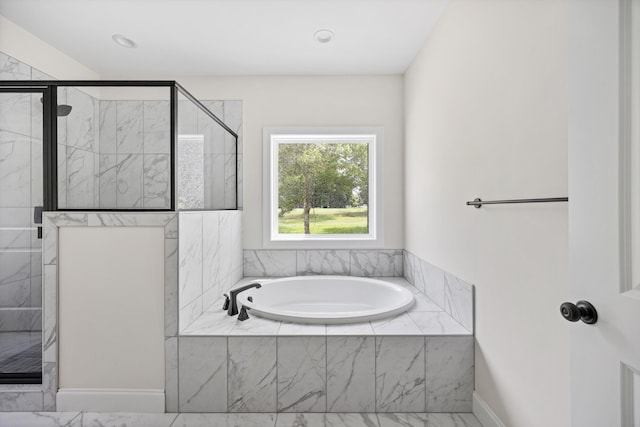 10822 Dallas Hollow Rd, Soddy Daisy, TN 37379 - full bathroom with a garden tub, a marble finish shower, and marble look tiles