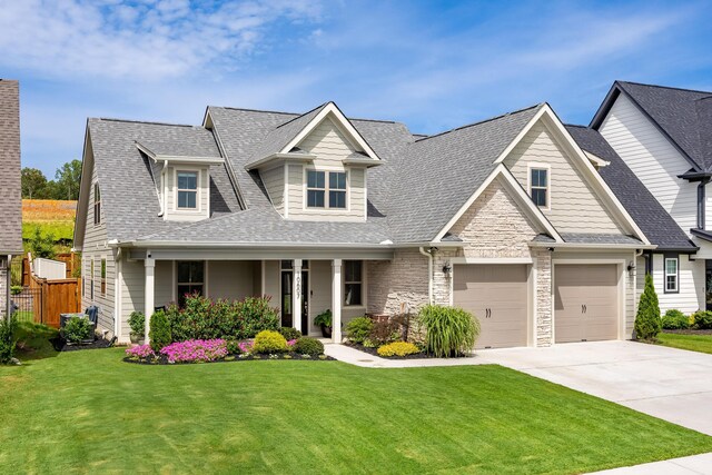 10607 Flicker Way, Apison, TN 37302 - view of front facade featuring concrete driveway, roof with shingles, and a porch
