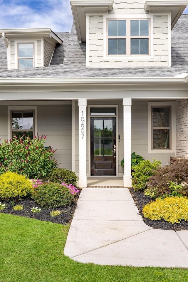 10607 Flicker Way, Apison, TN 37302 - doorway to property featuring covered porch and a shingled roof