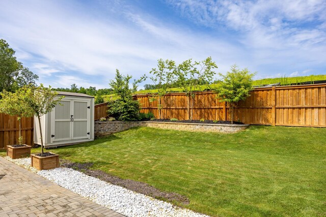 10607 Flicker Way, Apison, TN 37302 - fenced backyard featuring a storage unit