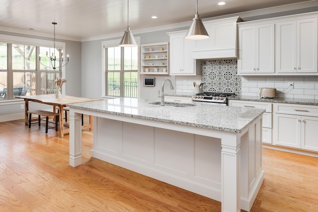 10607 Flicker Way, Apison, TN 37302 - kitchen featuring stove, tasteful backsplash, a chandelier, light wood-type flooring, and crown molding
