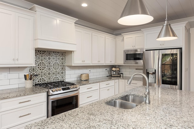 10607 Flicker Way, Apison, TN 37302 - kitchen with appliances with stainless steel finishes, white cabinetry, custom exhaust hood, hanging light fixtures, and recessed lighting
