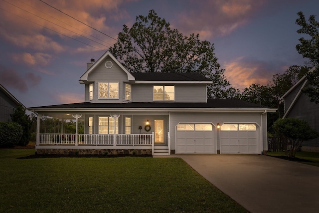 8616 Oak View Dr, Chattanooga, TN 37421 - view of front of home with a porch, concrete driveway, a yard, and an attached garage