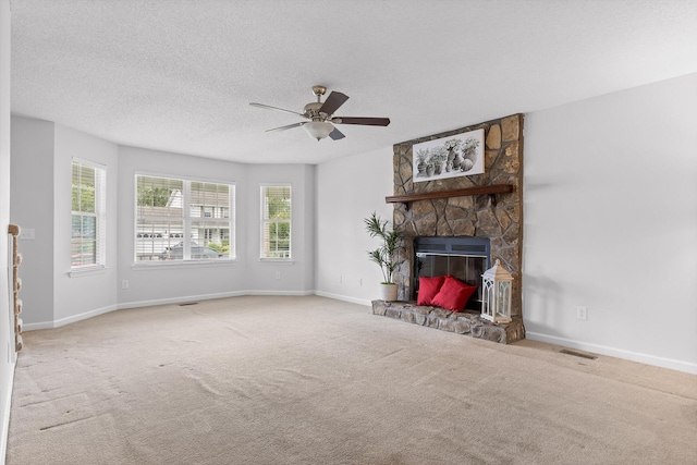 8616 Oak View Dr, Chattanooga, TN 37421 - unfurnished living room featuring a ceiling fan, carpet floors, a fireplace, and a textured ceiling