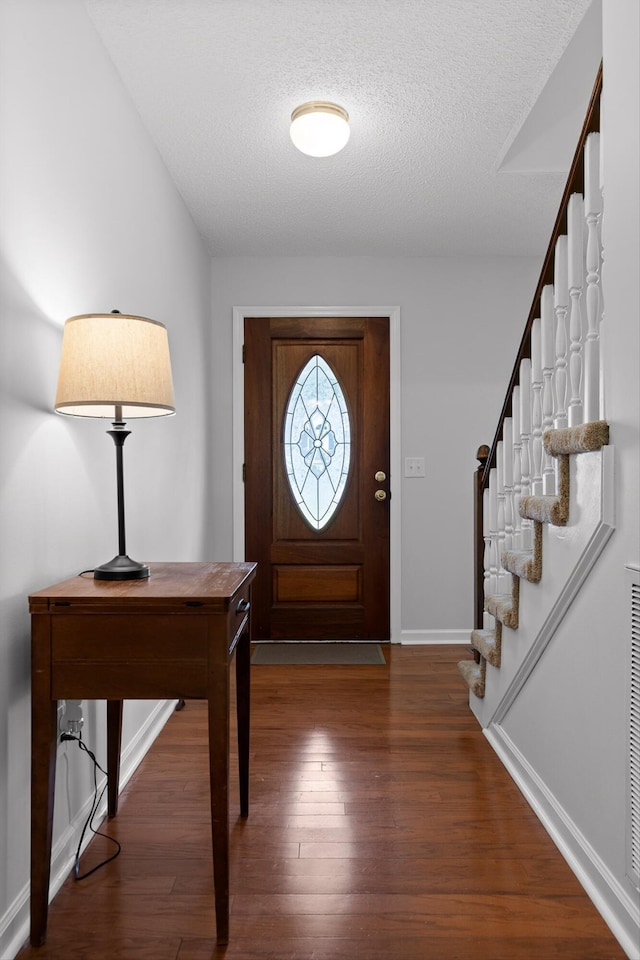 8616 Oak View Dr, Chattanooga, TN 37421 - entrance foyer with stairs, wood finished floors, and a textured ceiling