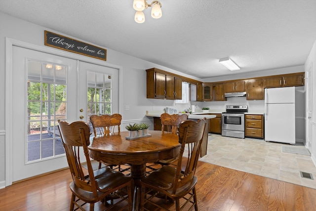 8616 Oak View Dr, Chattanooga, TN 37421 - dining area featuring a textured ceiling and light wood finished floors