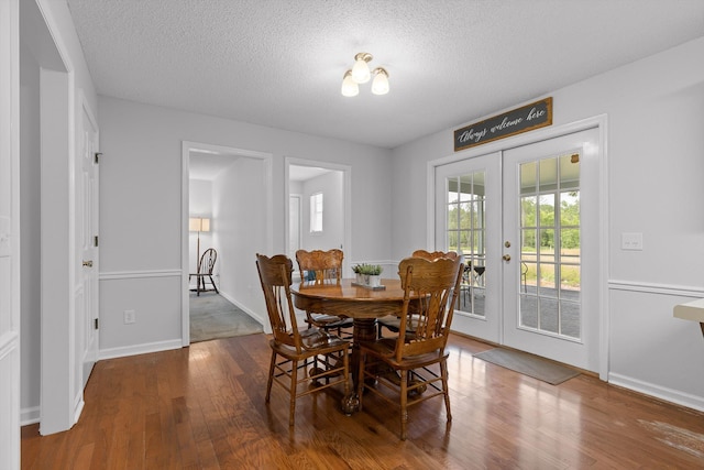 8616 Oak View Dr, Chattanooga, TN 37421 - dining area with french doors, wood finished floors, and a textured ceiling