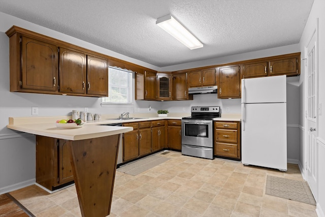 8616 Oak View Dr, Chattanooga, TN 37421 - kitchen with freestanding refrigerator, electric stove, under cabinet range hood, a peninsula, and dishwashing machine