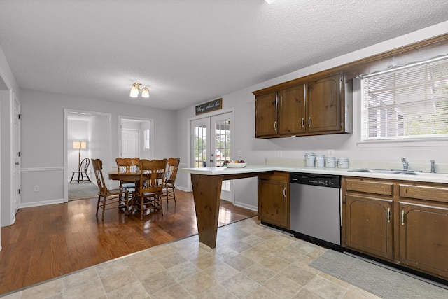8616 Oak View Dr, Chattanooga, TN 37421 - kitchen with stainless steel dishwasher, light countertops, a textured ceiling, and french doors