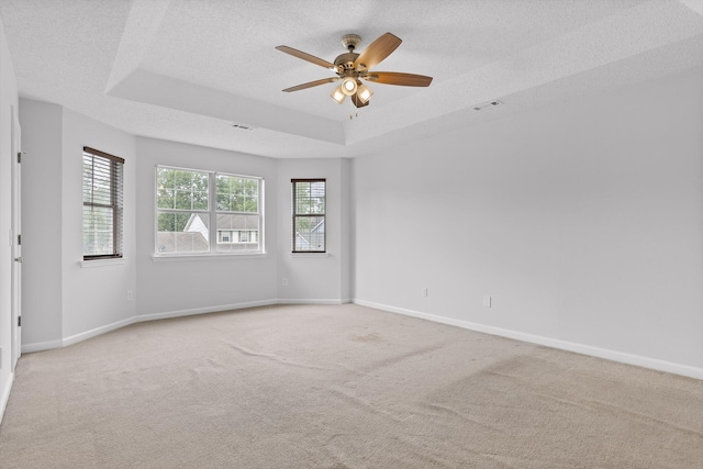 8616 Oak View Dr, Chattanooga, TN 37421 - unfurnished room with a raised ceiling, light carpet, a textured ceiling, and a ceiling fan