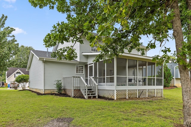 8616 Oak View Dr, Chattanooga, TN 37421 - rear view of house with a sunroom and a yard
