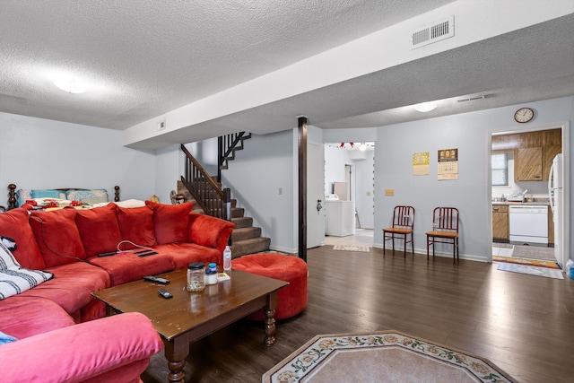 1433 Stratton Place Dr, Chattanooga, TN 37421 - living area with wood finished floors, a textured ceiling, stairs, and washer / clothes dryer