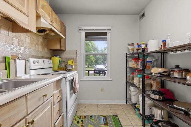 1433 Stratton Place Dr, Chattanooga, TN 37421 - kitchen featuring electric range, light tile patterned floors, tasteful backsplash, light countertops, and light brown cabinetry