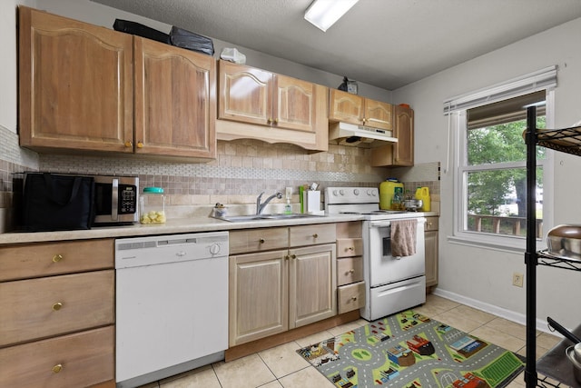 1433 Stratton Place Dr, Chattanooga, TN 37421 - kitchen featuring white appliances, under cabinet range hood, tasteful backsplash, light countertops, and light tile patterned floors