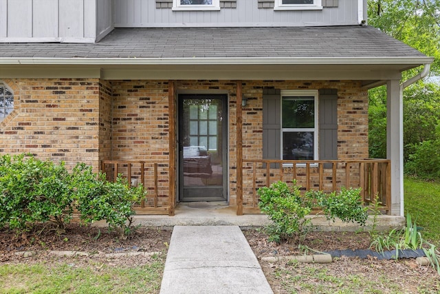 1433 Stratton Place Dr, Chattanooga, TN 37421 - doorway to property with a porch, brick siding, and board and batten siding