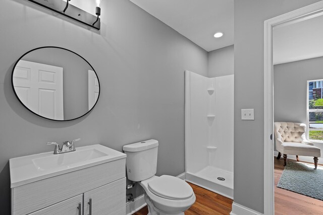 2001 Vine St, Chattanooga, TN 37404 - bathroom with wood finished floors, vanity, and a shower