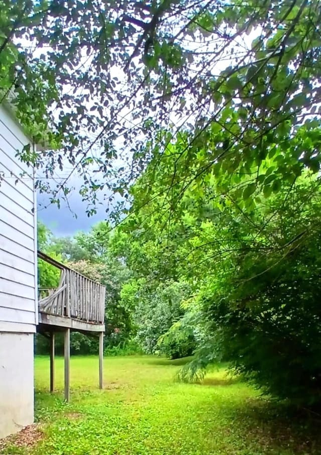 207 W 9th St, Chickamauga, GA 30707 - view of green lawn with a deck