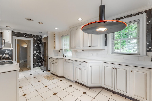 208 S Palisades Dr, Signal Mountain, TN 37377 - kitchen with white dishwasher, crown molding, wallpapered walls, healthy amount of natural light, and freestanding refrigerator