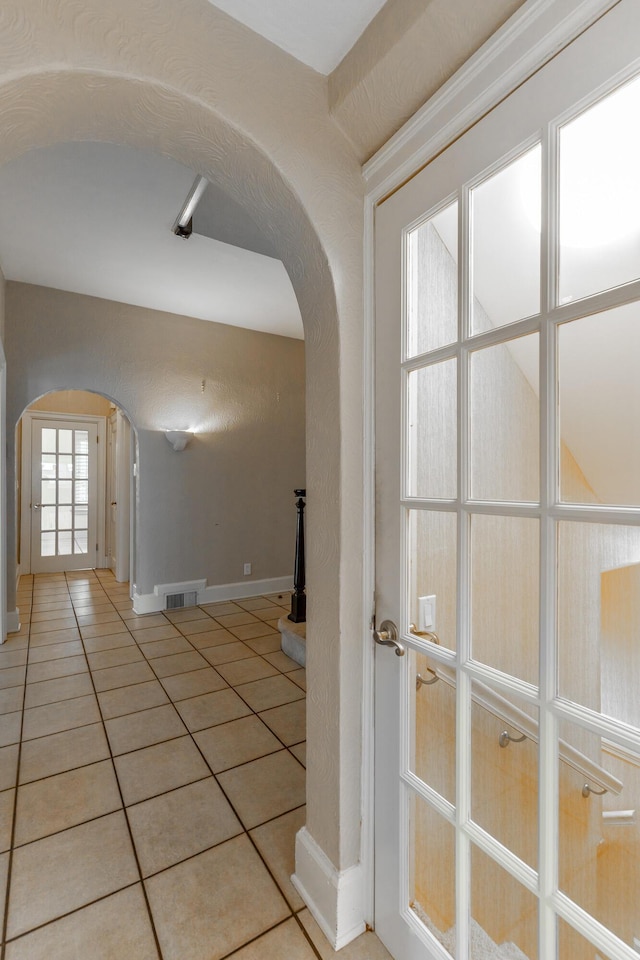 208 S Palisades Dr, Signal Mountain, TN 37377 - hallway with arched walkways and tile patterned flooring