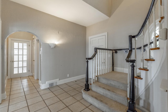 208 S Palisades Dr, Signal Mountain, TN 37377 - staircase with tile patterned floors and arched walkways