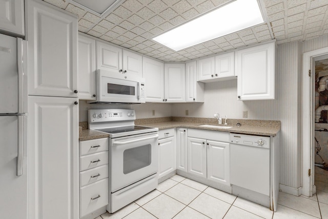 208 S Palisades Dr, Signal Mountain, TN 37377 - kitchen featuring white appliances, white cabinets, and light tile patterned flooring