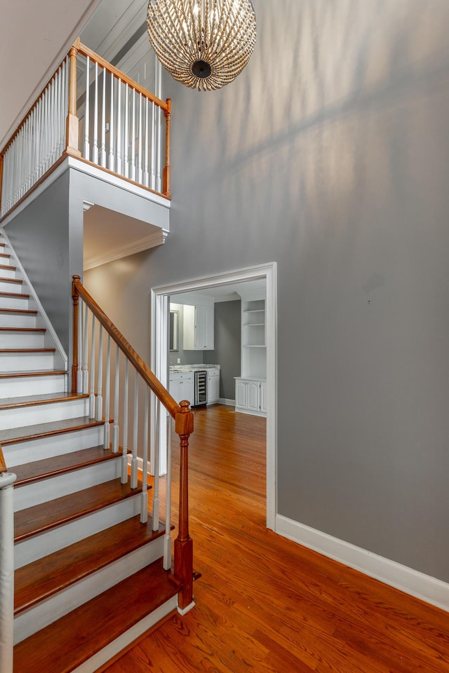 802 Signal Mountain Blvd Unit 121, Signal Mountain, TN 37377 - staircase with a high ceiling, a chandelier, wood finished floors, beverage cooler, and built in features