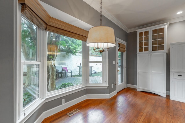 802 Signal Mountain Blvd Unit 121, Signal Mountain, TN 37377 - unfurnished dining area featuring ornamental molding, wood finished floors, and a chandelier
