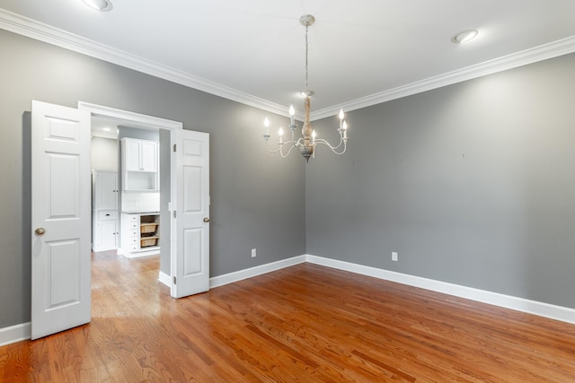 802 Signal Mountain Blvd Unit 121, Signal Mountain, TN 37377 - spare room with ornamental molding, a chandelier, and wood finished floors