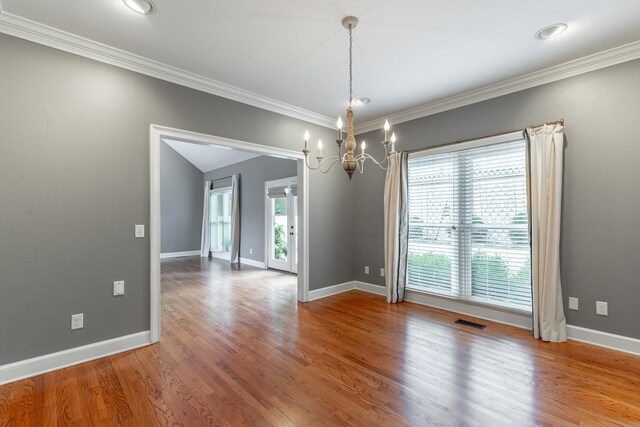 802 Signal Mountain Blvd Unit 121, Signal Mountain, TN 37377 - spare room with a chandelier, wood finished floors, and crown molding