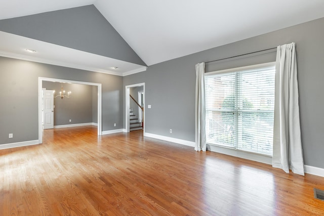 802 Signal Mountain Blvd Unit 121, Signal Mountain, TN 37377 - unfurnished room featuring a chandelier, stairway, healthy amount of natural light, crown molding, and light wood finished floors