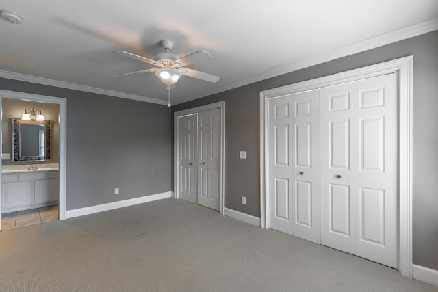802 Signal Mountain Blvd Unit 121, Signal Mountain, TN 37377 - unfurnished bedroom featuring multiple closets, light carpet, ornamental molding, ensuite bathroom, and a ceiling fan