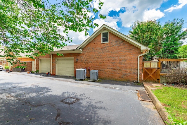 802 Signal Mountain Blvd Unit 121, Signal Mountain, TN 37377 - view of home's exterior with a gate, brick siding, and an attached garage