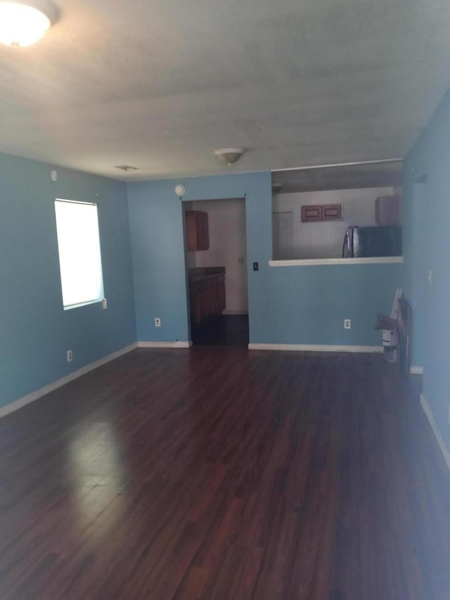1513 Mountain View Ct, Chattanooga, TN 37409 - unfurnished living room with dark wood finished floors and baseboards