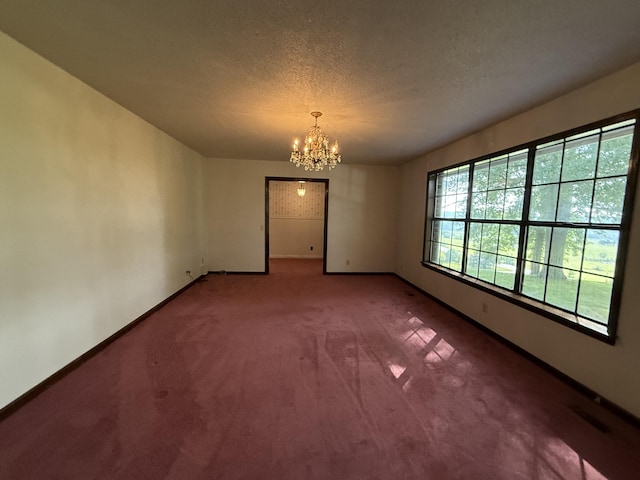 30551 Al Al Unit 71, Bryant, AL 35958 - carpeted empty room with a chandelier and a textured ceiling
