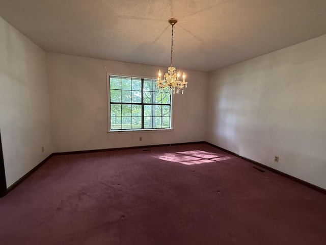30551 Al Al Unit 71, Bryant, AL 35958 - spare room featuring a chandelier and carpet