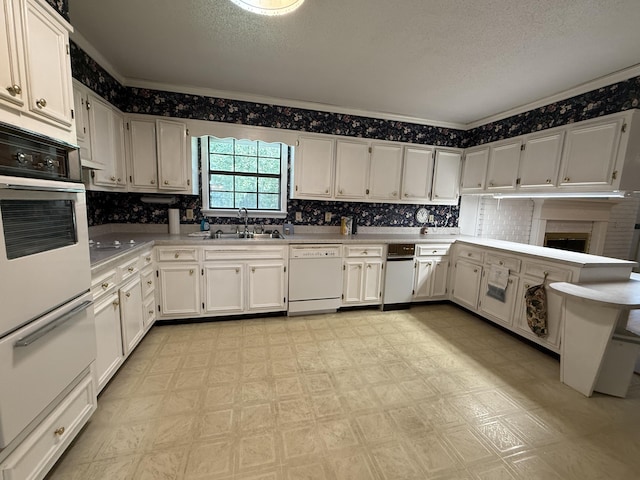 30551 Al Al Unit 71, Bryant, AL 35958 - kitchen featuring white appliances, light floors, light countertops, white cabinets, and a textured ceiling
