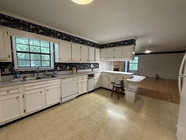 30551 Al Al Unit 71, Bryant, AL 35958 - kitchen featuring dishwasher, light floors, white cabinetry, a ceiling fan, and light countertops