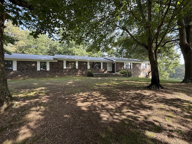 30551 Al Al Unit 71, Bryant, AL 35958 - view of front of home featuring brick siding and a metal roof