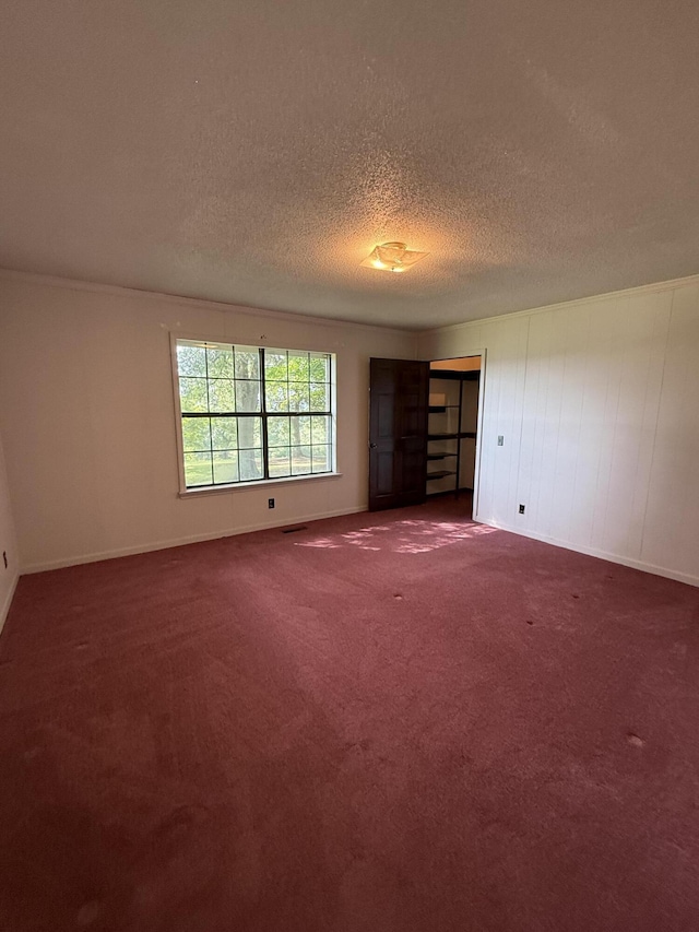 30551 Al Al Unit 71, Bryant, AL 35958 - carpeted empty room with a textured ceiling and baseboards