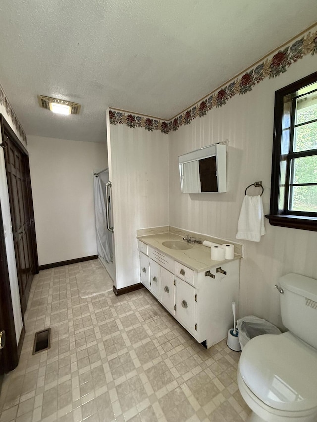 30551 Al Al Unit 71, Bryant, AL 35958 - bathroom featuring vanity, a shower, tile patterned floors, and a textured ceiling