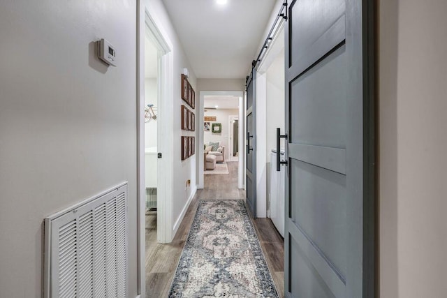 414 N Three Notch Rd, Ringgold, GA 30736 - corridor featuring wood finished floors and a barn door