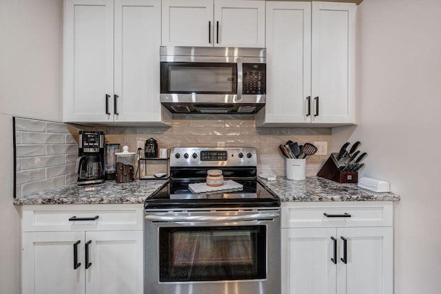 414 N Three Notch Rd, Ringgold, GA 30736 - kitchen with appliances with stainless steel finishes, decorative backsplash, white cabinets, and light stone countertops