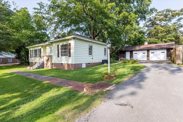 147 Kirby St, Summerville, GA 30747 - view of front of house featuring a garage, an outdoor structure, a front yard, and crawl space