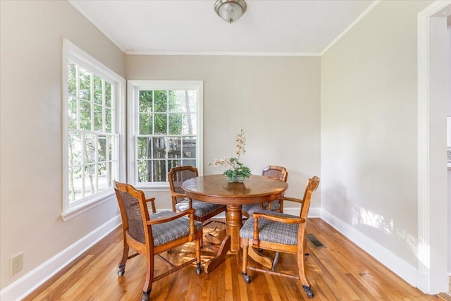 147 Kirby St, Summerville, GA 30747 - dining room with light wood-style flooring and ornamental molding