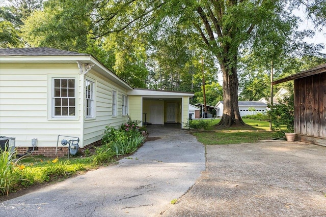147 Kirby St, Summerville, GA 30747 - view of exterior entry featuring concrete driveway and an attached carport