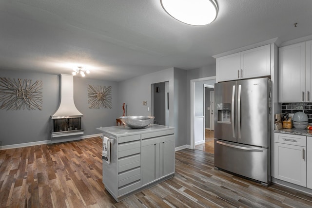 409 Caraway Turn, Chattanooga, TN 37415 - kitchen featuring stainless steel refrigerator with ice dispenser, dark wood finished floors, tasteful backsplash, and white cabinets