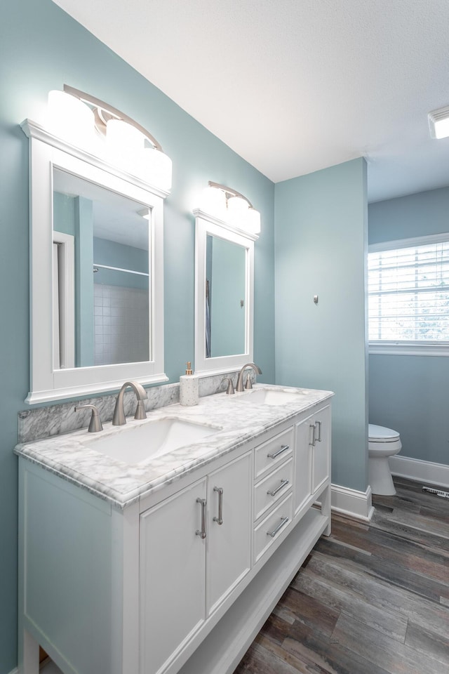 409 Caraway Turn, Chattanooga, TN 37415 - bathroom with double vanity and wood finished floors