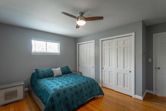409 Caraway Turn, Chattanooga, TN 37415 - bedroom featuring multiple closets, light wood finished floors, and ceiling fan