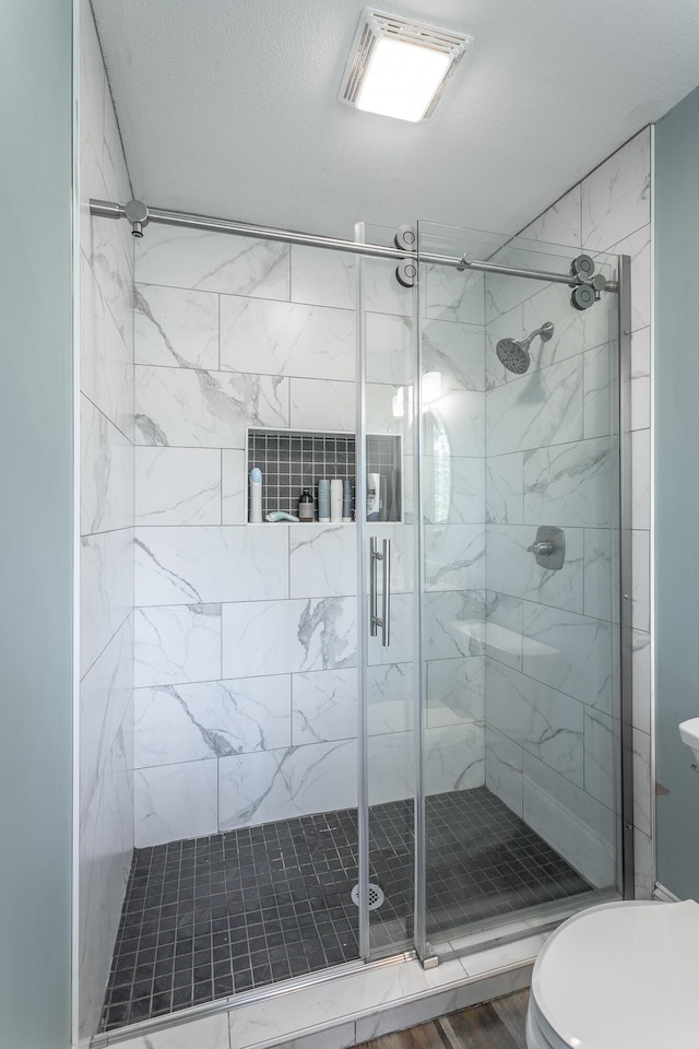 409 Caraway Turn, Chattanooga, TN 37415 - bathroom with a shower stall and wood finished floors