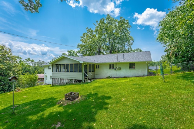 409 Caraway Turn, Chattanooga, TN 37415 - view of front facade with a sunroom, an outdoor fire pit, and a gate